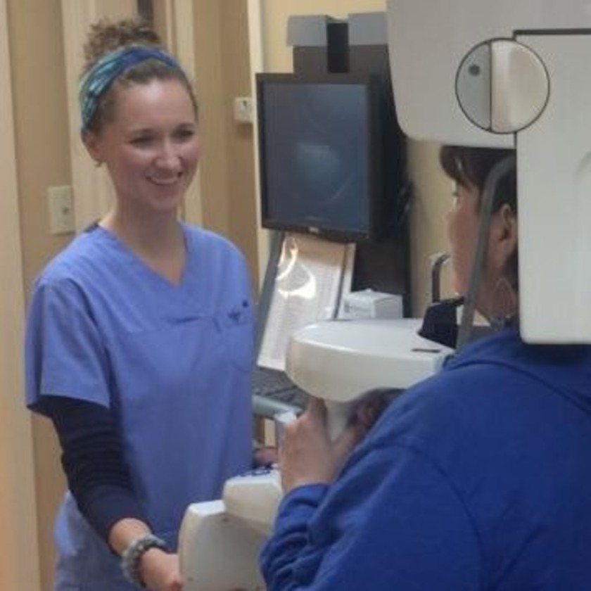 Photo of dental expert talking to patient