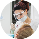 Photo of woman receiving dental treatment